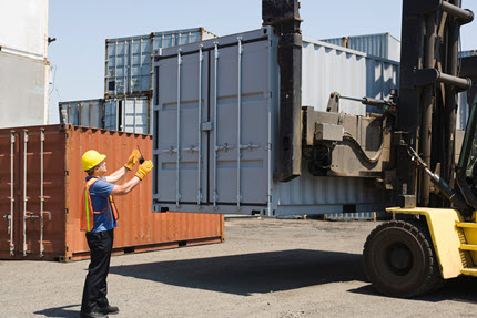 Field Service Management Workers Stacking Containers